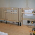 Fitted oak furniture in position, with concealed cistern