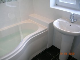 Curved quadrant bathroom suite expertly fitted by Aqua Systems