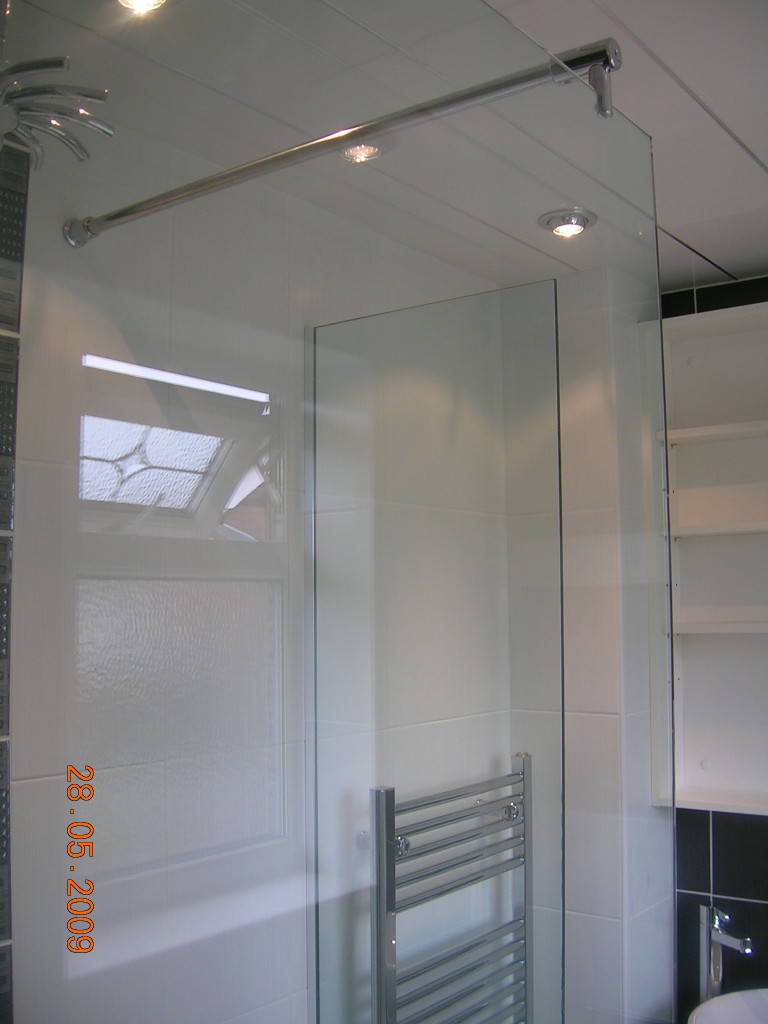 Frameless shower glass panels