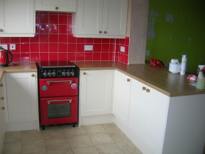 Tiled kitchen and flooring down